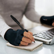 Copper Compression Half Finger Gloves, a gloved hand writing with a pen beside a calculator