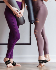Copper Compression Arch Support Sleeves, two women with yoga mats, both wearing black arch supports