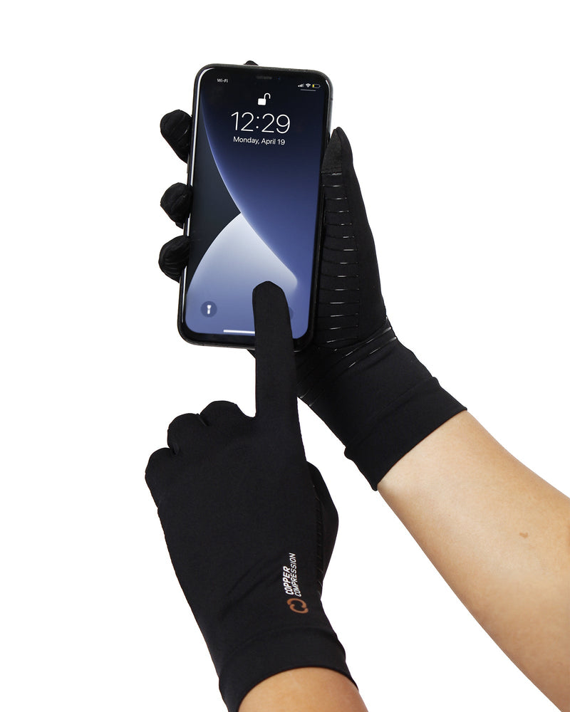 Copper Compression Full Finger Gloves, a gloved hand operating a smartphone touchscreen