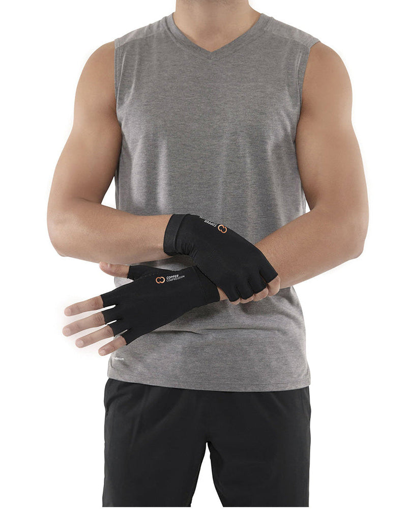 Copper Compression Half Finger Gloves, the gloves worn on both hands in front of a grey top