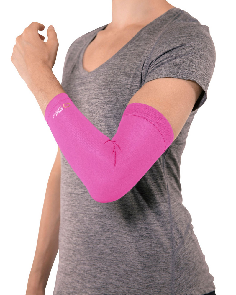 Copper Compression Elbow Sleeve, the pink elbow sleeve worn by a woman in a grey top