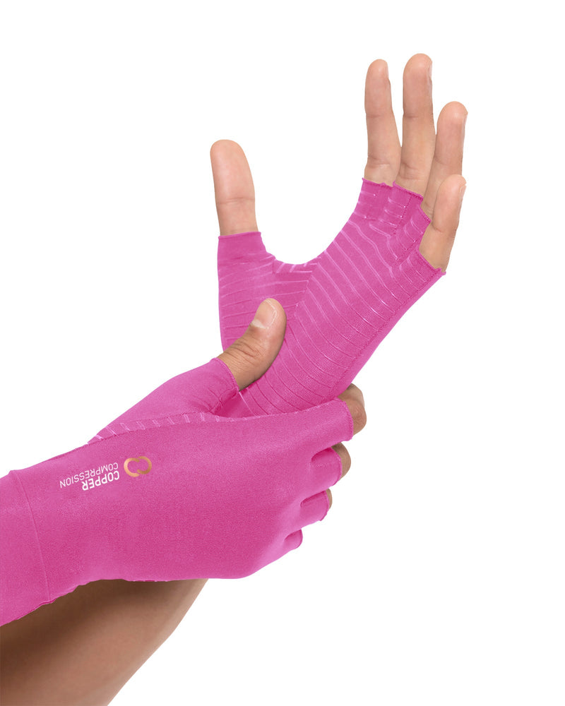 Copper Compression Half Finger Gloves, the pink gloves on a pair of hands with the other colours shown beside them