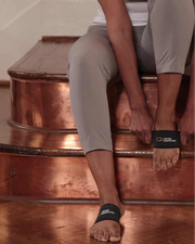 Copper Compression Arch Support Sleeves, the arch support worn on a foot against a plain background