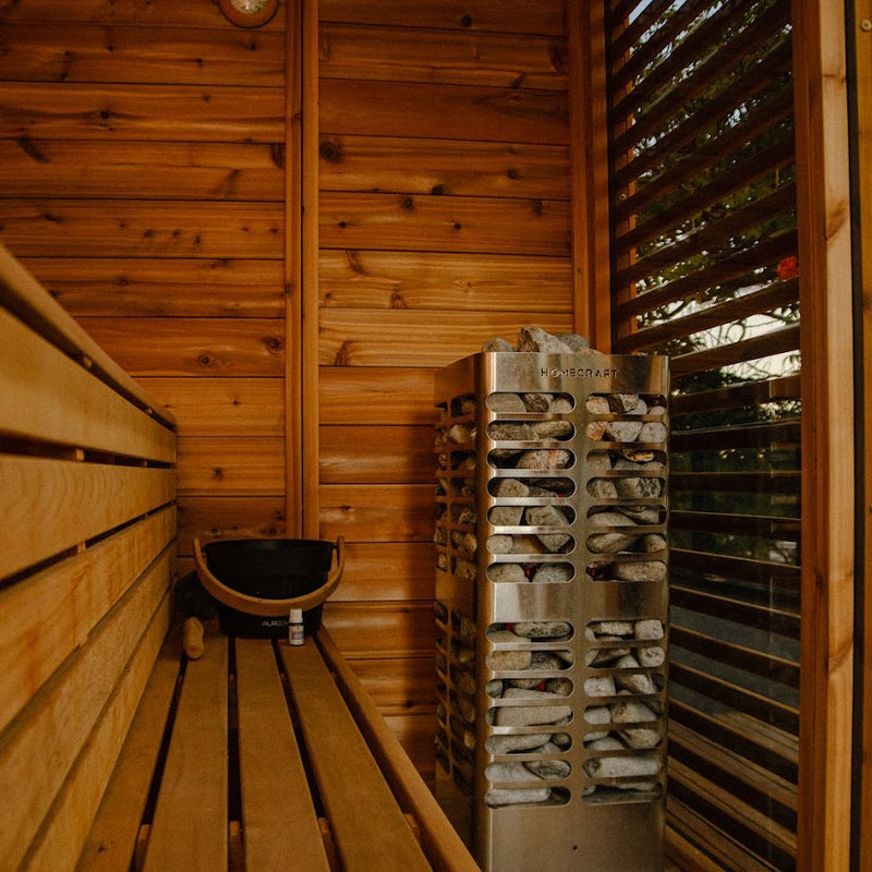 Homecraft Revive sauna heater in a cedar sauna with a slatted window