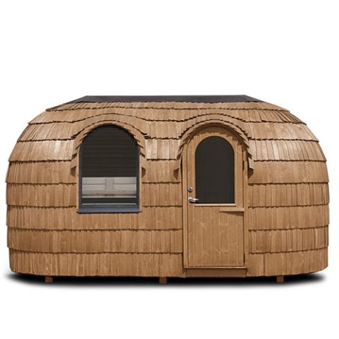 Iglucraft Double Iglusauna in Chestnut finish — front view showing the arched door on the right and two arched windows along the front, set into triple-layered spruce shingles, with the rounded form spanning 15 feet wide