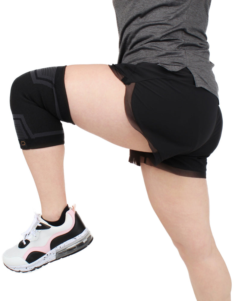 Copper Compression PowerKnit Knee Sleeve, a person in shorts and trainers with one leg raised, wearing the sleeve