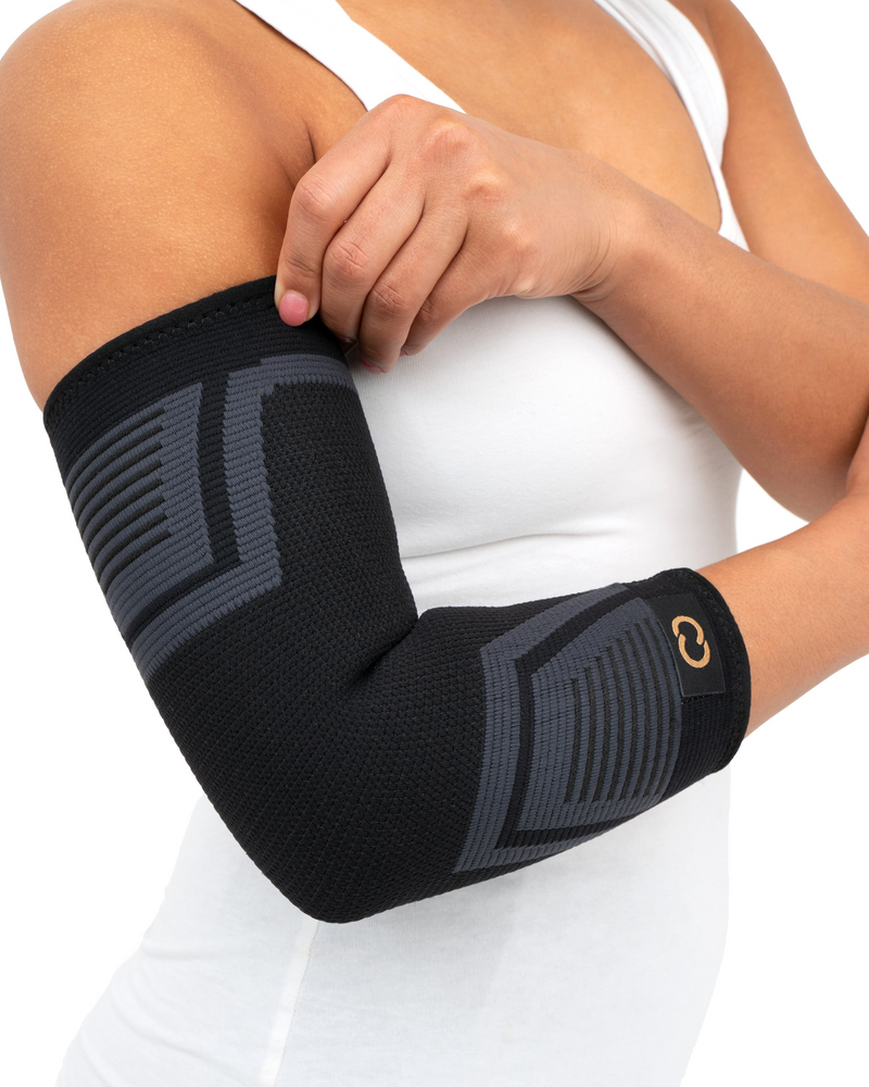 Copper Compression PowerKnit Elbow Sleeve, the PowerKnit elbow sleeve worn by a woman in a white top