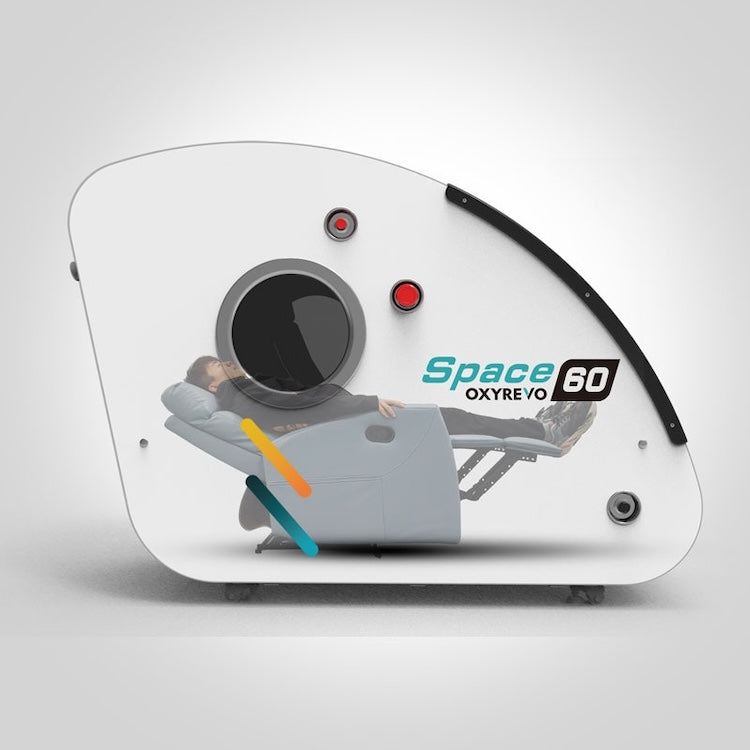 Cutaway view of the OxyRevo Space60 showing an occupant reclined with the chair folded back