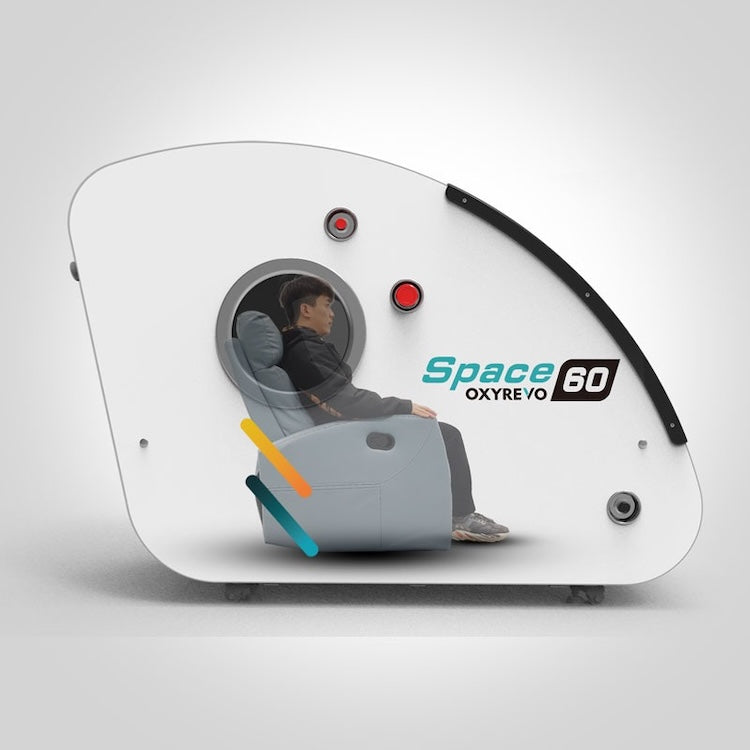 Cutaway view of the OxyRevo Space60 showing an occupant sitting upright in the folding chair