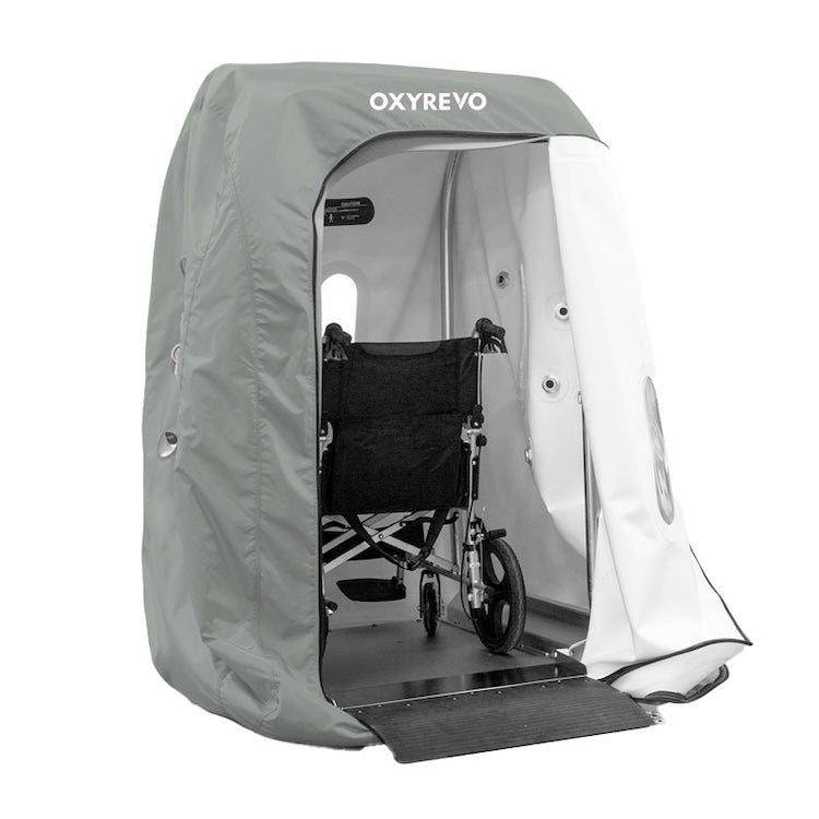 Open OxyRevo Heal40 chamber with a wheelchair positioned inside on the entry ramp