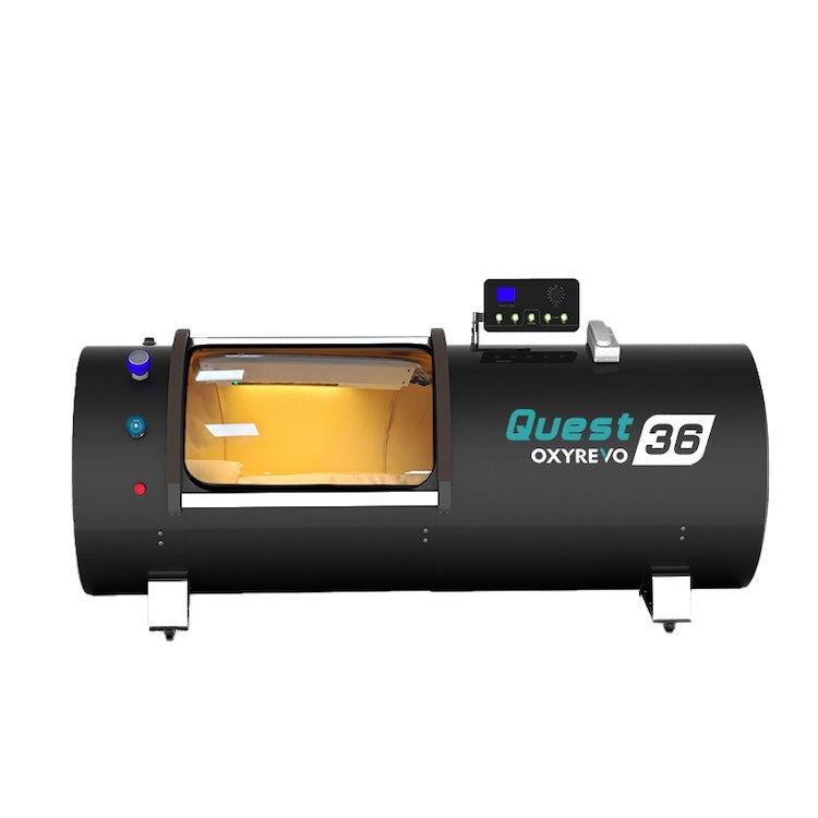Black OxyRevo Quest36 hyperbaric chamber viewed from three-quarters, showing the circular door and side of the cylinder