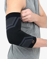 Copper Compression PowerKnit Elbow Sleeve, the grey and black PowerKnit elbow sleeve worn on a bent arm
