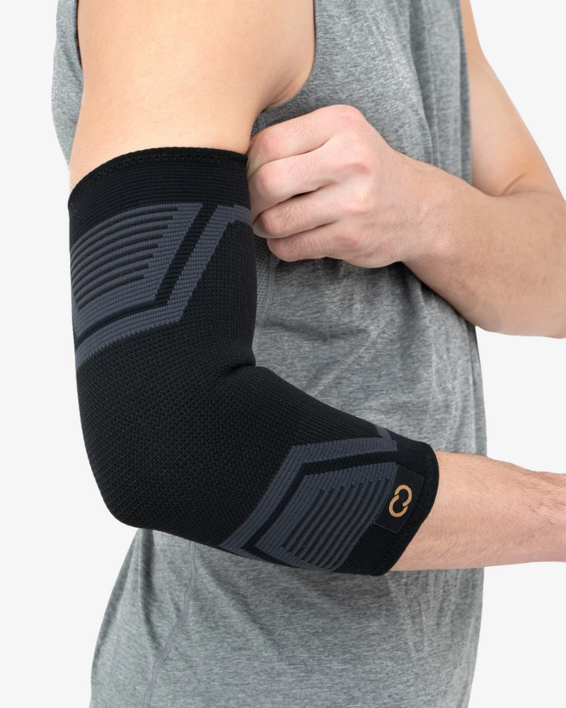 Copper Compression PowerKnit Elbow Sleeve, the grey and black PowerKnit elbow sleeve worn on a bent arm