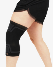 Copper Compression PowerKnit Knee Sleeve, the black PowerKnit knee sleeve worn on a leg