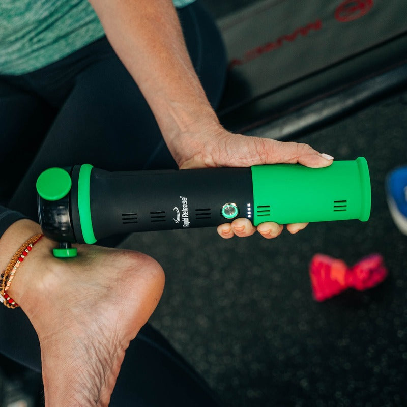 Rapid Release® P3i Vibration Massager in use on an ankle in a gym