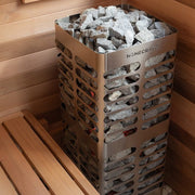 Homecraft Revive sauna heater with stones in a sauna corner