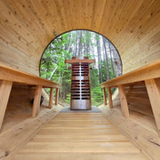 Homecraft Revive sauna heater in a barrel sauna with a round window