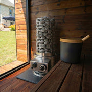Barrel sauna interior with the Titan SL1 heater centered between two benches
