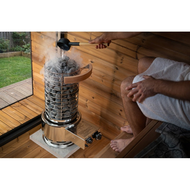 Heater on white with the water tank fitted, wooden lid on the stone column