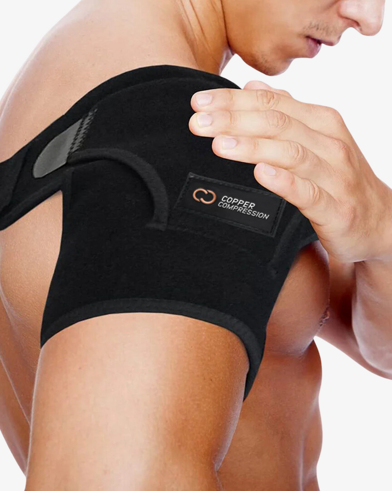 Copper Compression Shoulder Brace, the black shoulder brace worn over a shoulder, seen from behind
