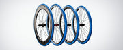 Garmin Tacx Trainer Tires, four blue tires on road wheels