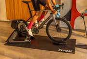 Garmin Tacx Rollable Trainer Mat under a smart trainer and bike