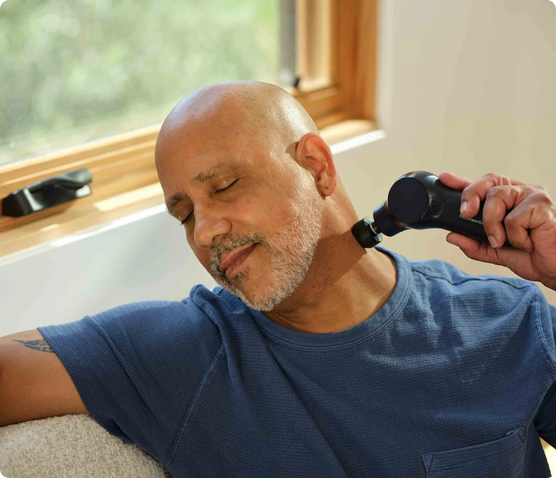 Therabody ThermFace Massage on the side of the neck