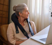 Therabody ThermNeck & Upper Back worn at a laptop