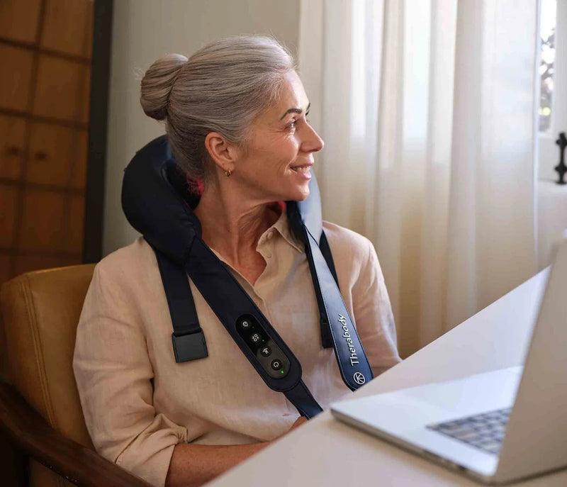Therabody ThermNeck & Upper Back worn at a laptop