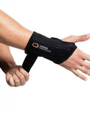 Copper Compression Advanced Wrist Brace, a hand tightening the strap on the wrist brace