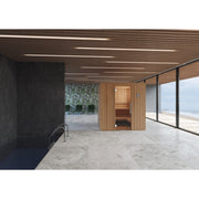 Auroom Familia indoor sauna - installed in glass-walled pool house