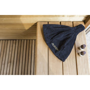 Auroom Sauna Hat - black felt hat on bench with sand timer
