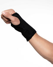 Copper Compression Advanced Wrist Brace, the wrist brace worn on a forearm against a white background