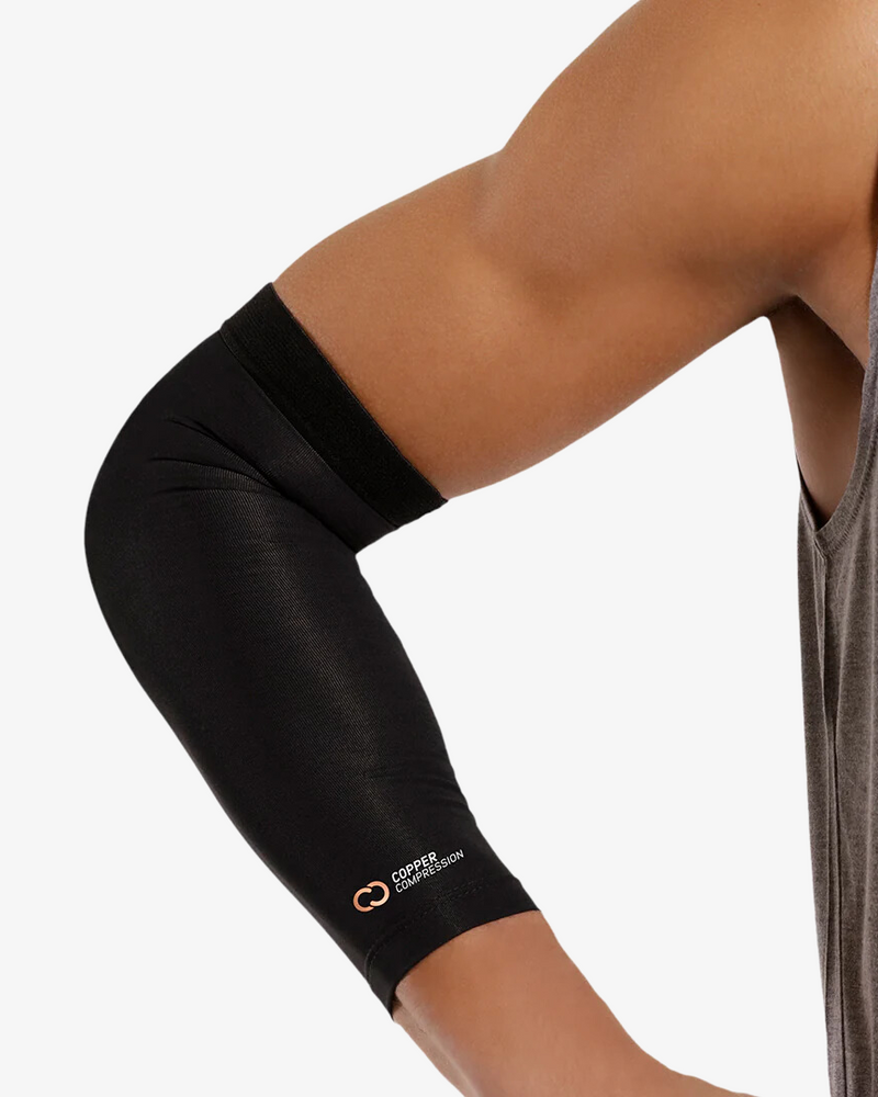 Copper Compression Elbow Sleeve, the black elbow sleeve worn on a bent arm