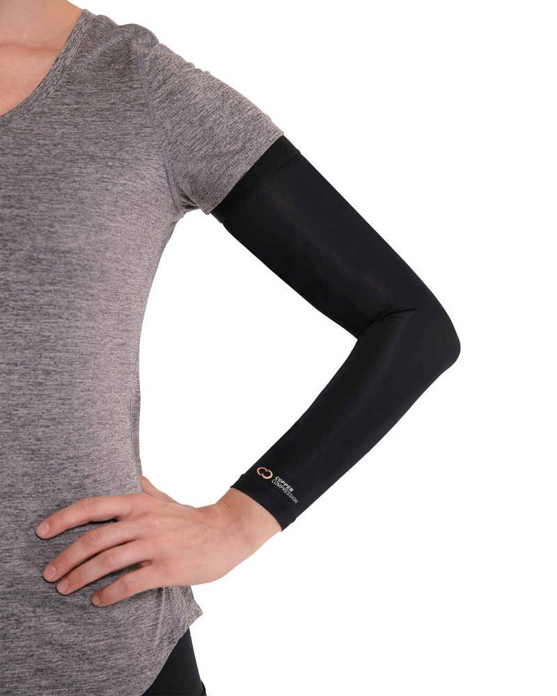 Copper Compression Full Arm Sleeve, the full arm sleeve worn by a woman with a hand on the hip