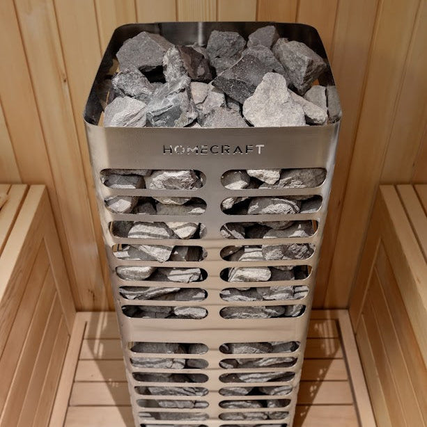 Homecraft Revive sauna heater loaded with stones in a cedar sauna