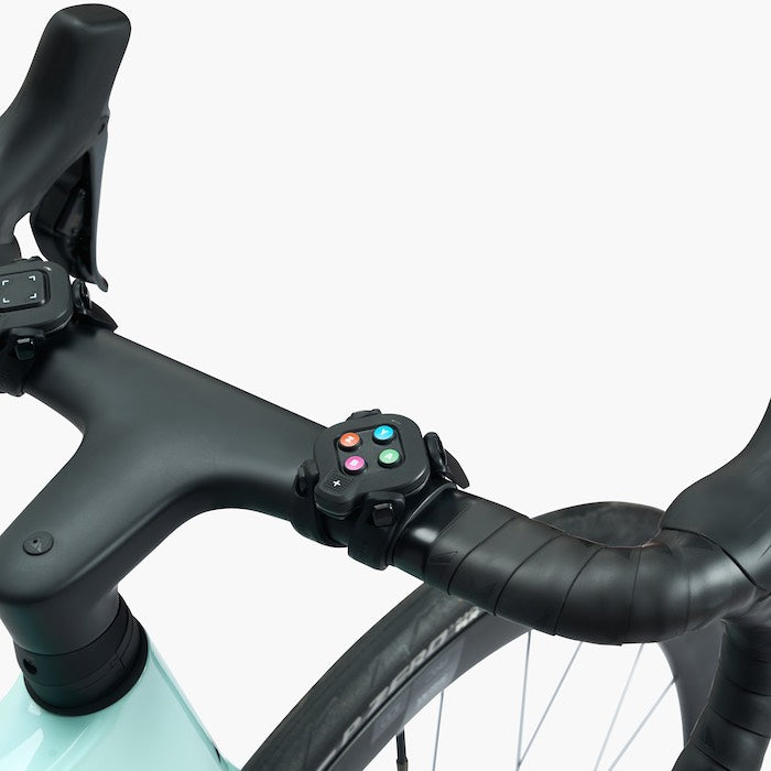 Wahoo KICKR Zwift Cog, Zwift Click mounted on a bike handlebar