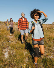 Copper Compression Knee Sleeve, three people hiking outdoors, one wearing the knee sleeve