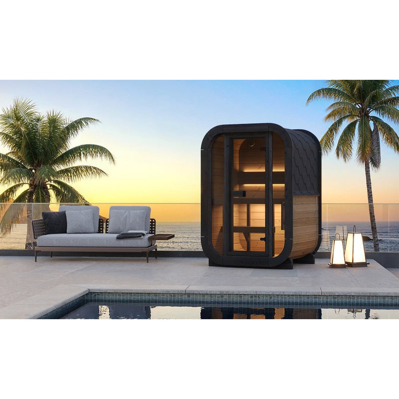 SaunaLife CL3G 2-Person Cube-Series Outdoor Home Sauna - poolside terrace at sunset with palm trees