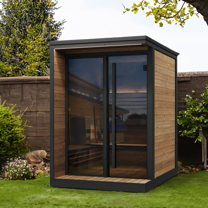 SaunaLife GL4 4-Person Outdoor Traditional Sauna - garden setting beside a brick wall