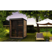 SaunaLife GL4 4-Person Outdoor Traditional Sauna - backyard lawn setting at dusk