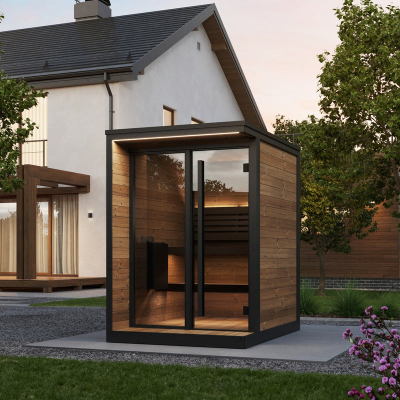 SaunaLife GL4 4-Person Outdoor Traditional Sauna - patio setting beside a house at dusk