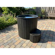 SaunaLife Model S1 1-Person Cold/Hot Tub - black finish tub on a brick patio