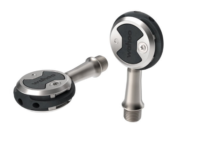 Wahoo SPEEDPLAY NANO, two pedals, one flat and one standing on its spindle end