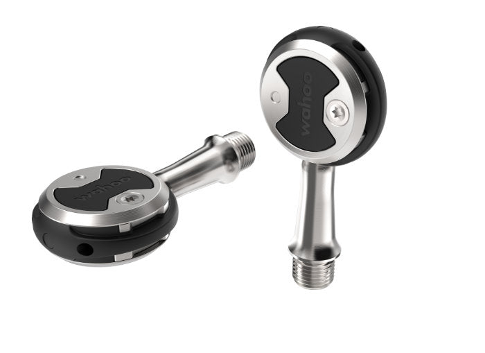 Wahoo SPEEDPLAY ZERO, two pedals, one flat and one standing on its spindle end