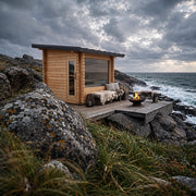 Dundalk Leisurecraft Avalon Sauna on a seaside deck at dusk