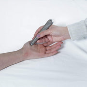 HawkGrips Tongue Depressor HG9 IASTM Instrument being used on hand
