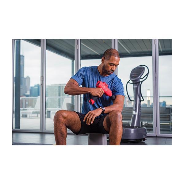 Power Plate Pulse Percussion Massager being used on arm